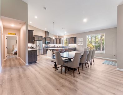 Dining area and full kitchen with island seating at Bandon's Trail House