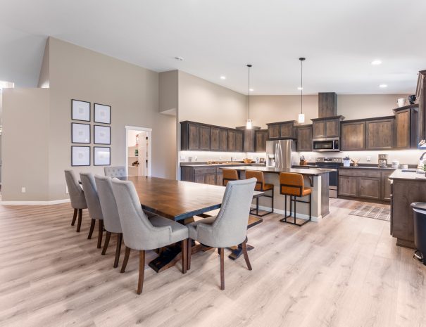 Large dining table and kitchen with bar seating at Bandon Dunes rental house