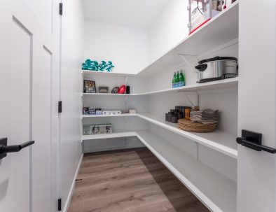 Walk-in pantry with games and kitchen supplies at Trail House vacation rental