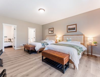 Bedroom with two queen beds and ensuite bathroom access at Bandon Dunes vacation rental