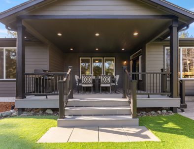 Covered patio with seating and dining area at Bandon's Trail House vacation rental