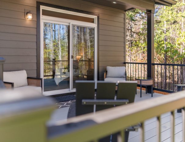 Deck with seating and forest views at Trail House golf rental near Bandon Dunes