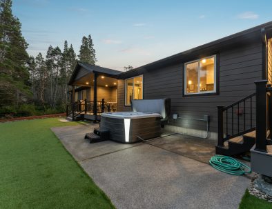 Hot tub and covered porch at Bandon's Trail House vacation rental