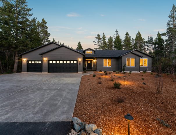 Trail House exterior with landscaped yard on 2 wooded acres